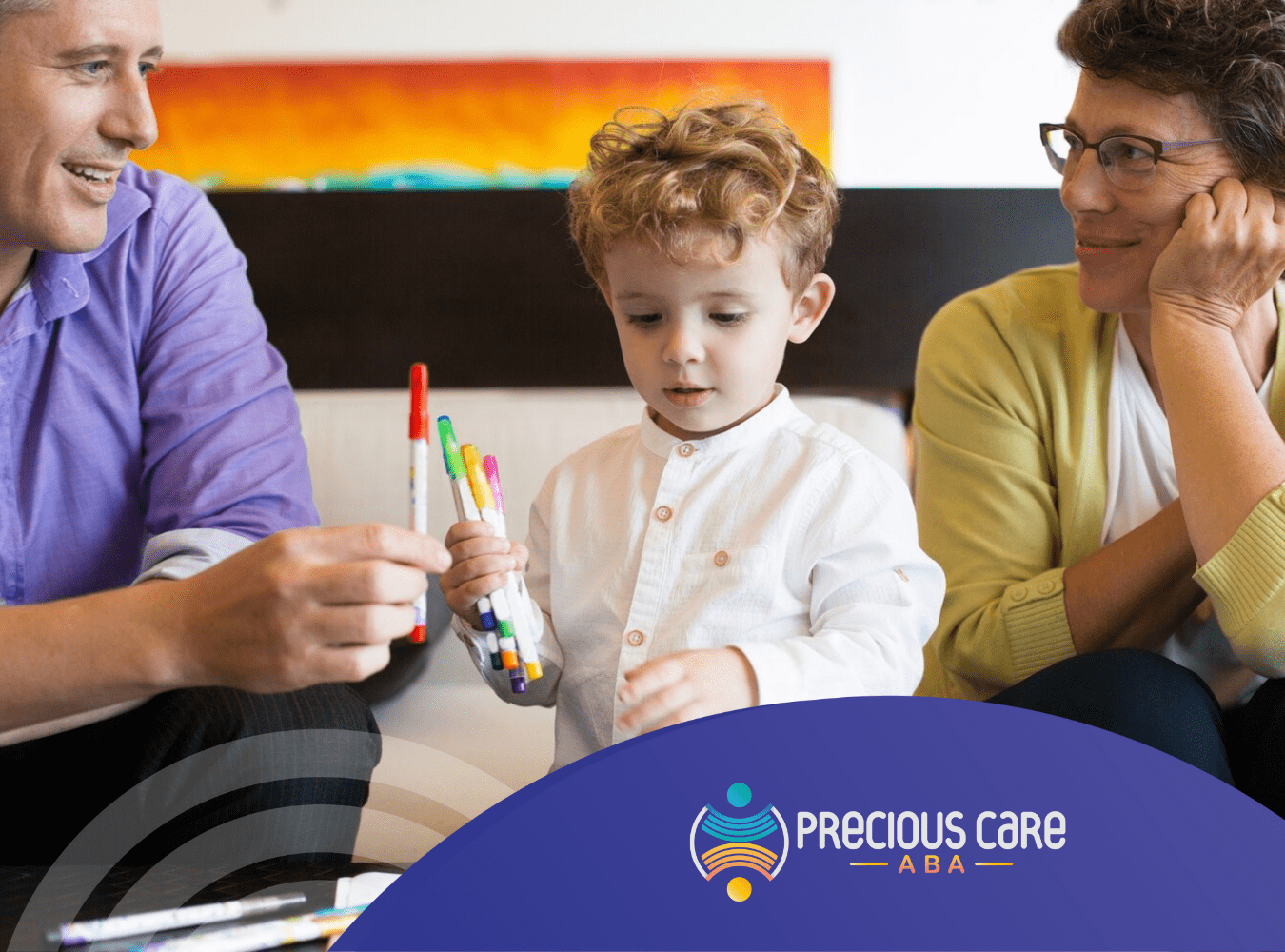 A child drawing with markers during ABA therapy session