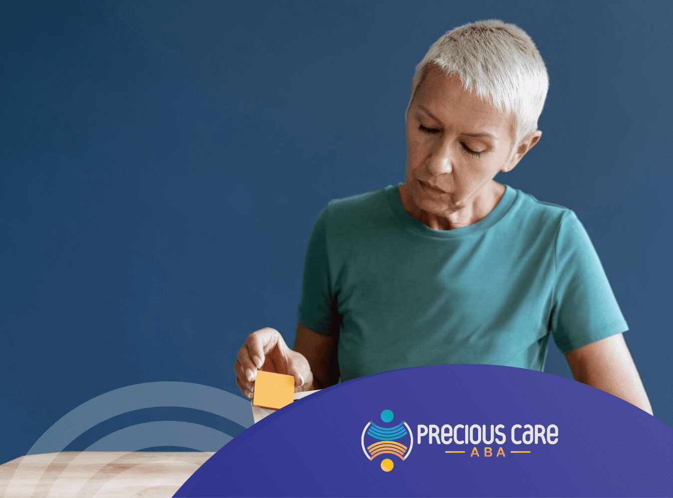 An adult with mild autism holding fidget blocks