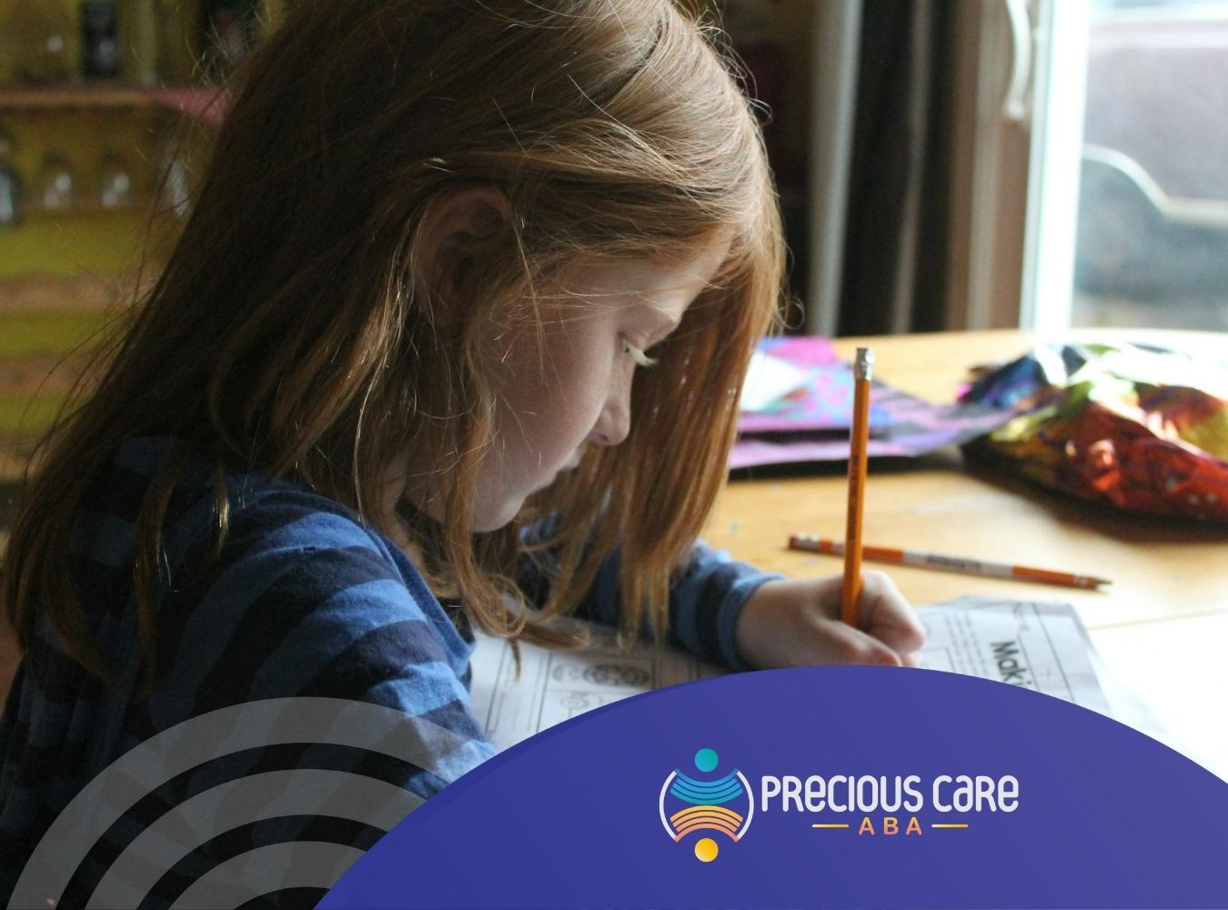 Girl with autism focusing intently on a worksheet at a wooden table in a cozy home in Maryland.