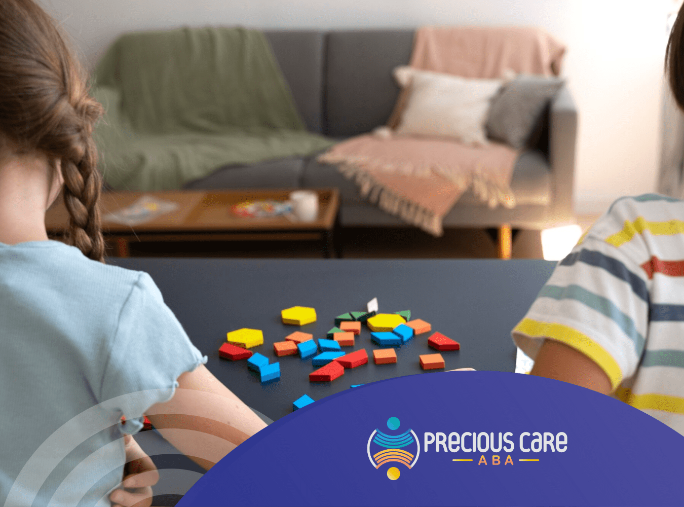Two autistic kids playing colorful blocks on a table