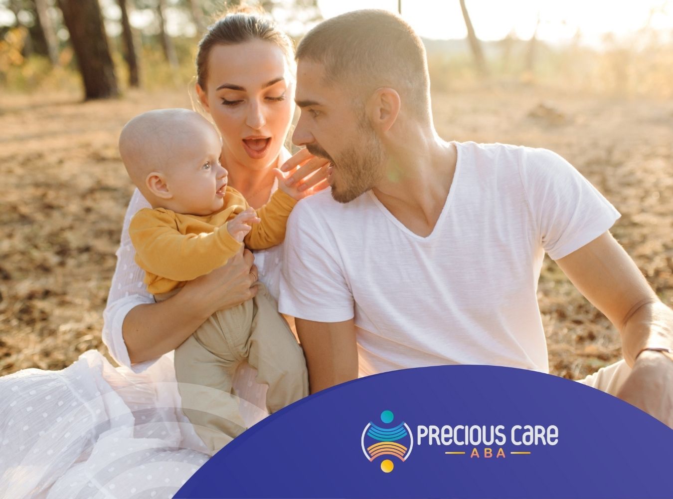 A family of three playfully interacting outdoors.