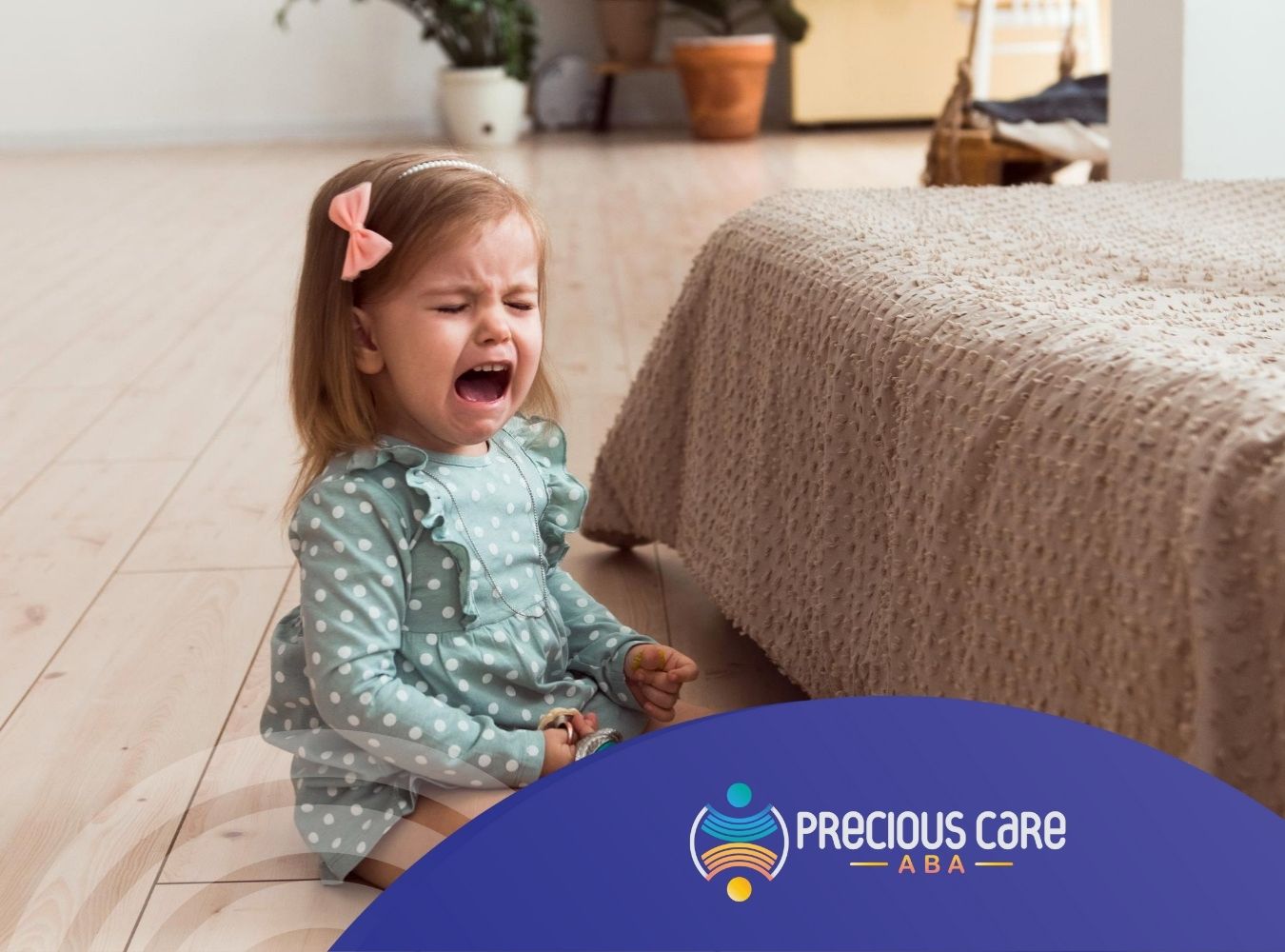 Upset child sitting on the floor, crying.