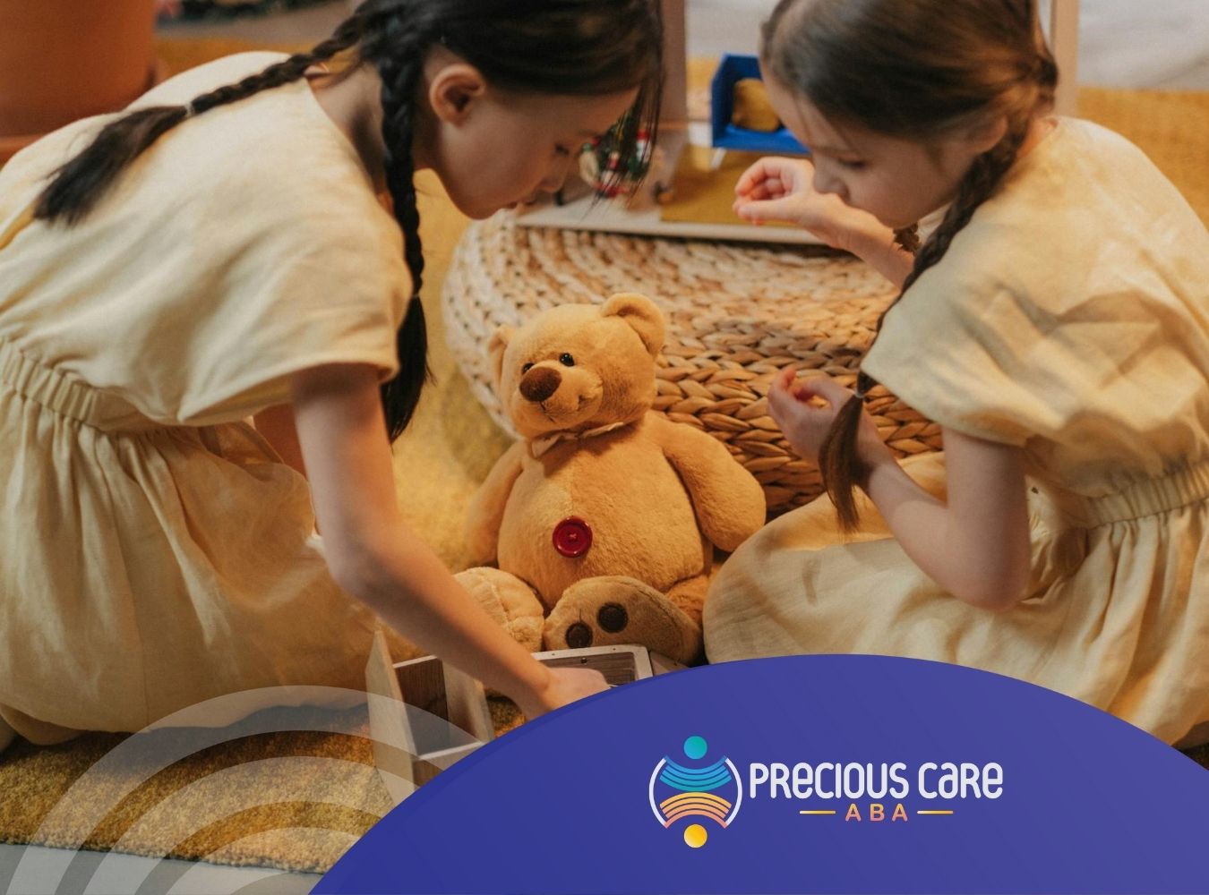 Two autistic girls in yellow dresses playing with a teddy bear and small toys on a rug in Colorado.