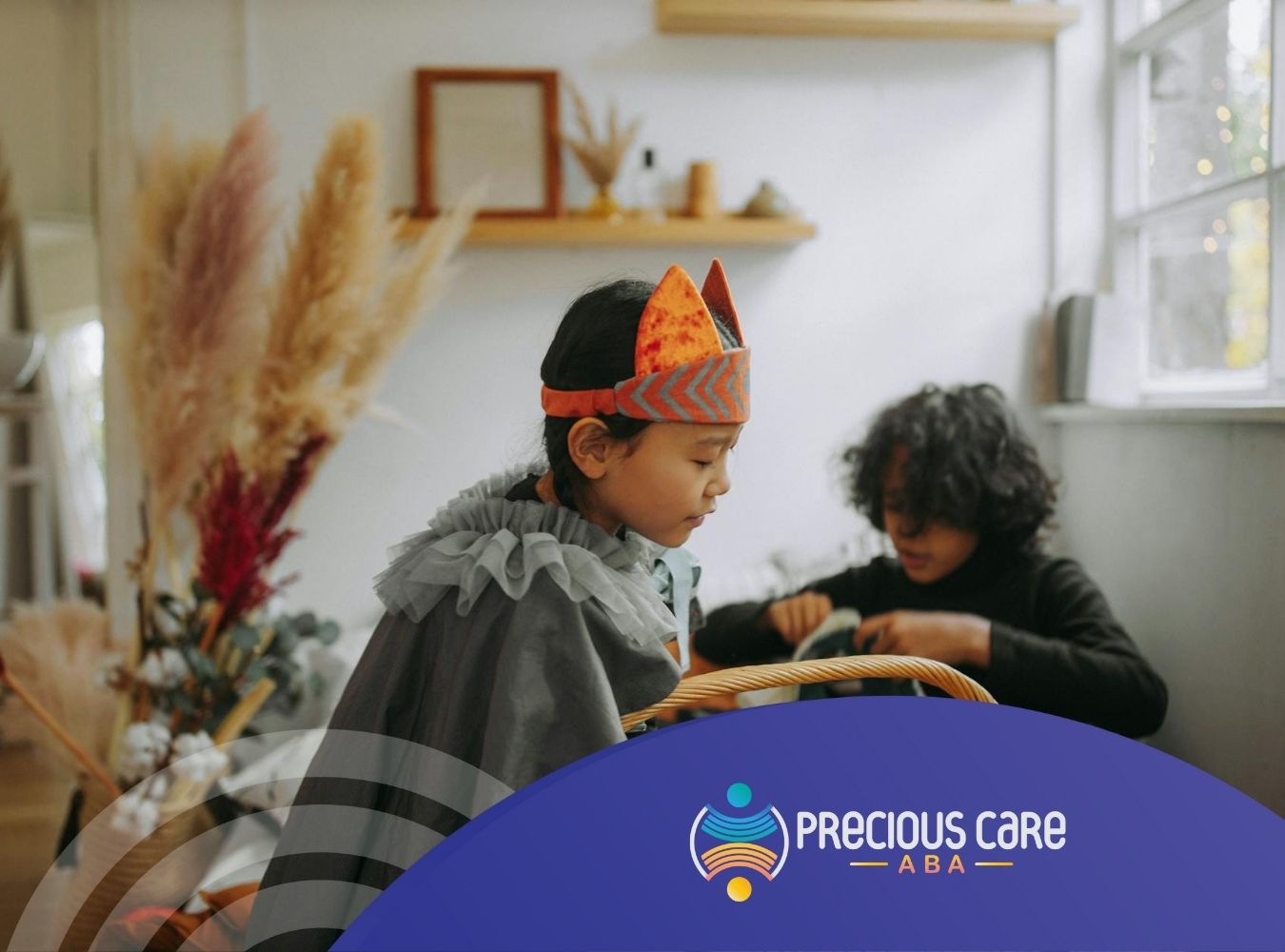 Autistic children playing dress-up with costumes and accessories at a cozy room in New Jersey.