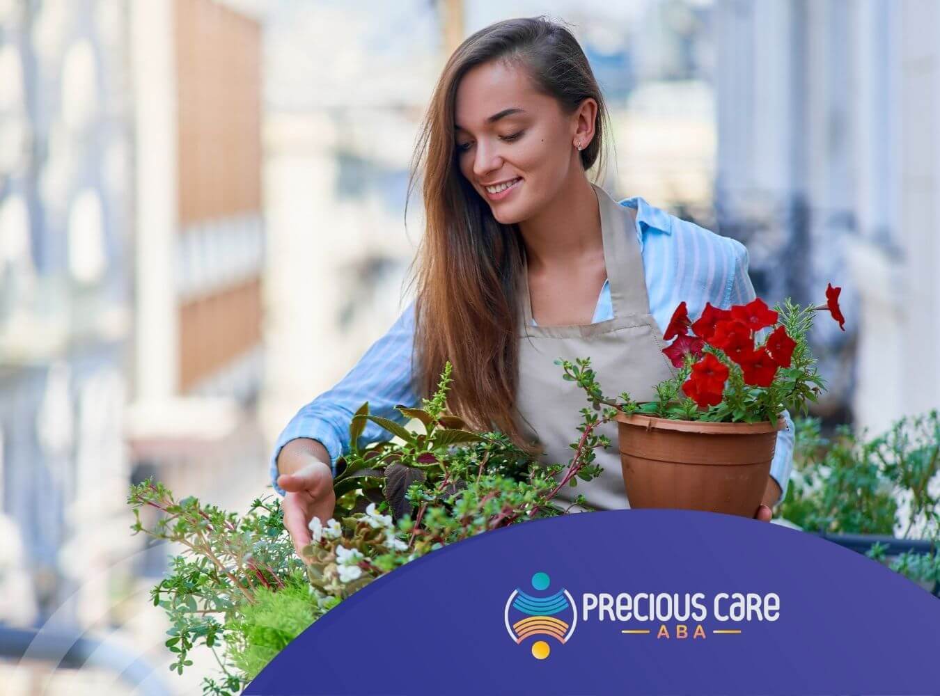 A woman with autism is smiling while gardening and holding a pot with flowers on a balcony.
