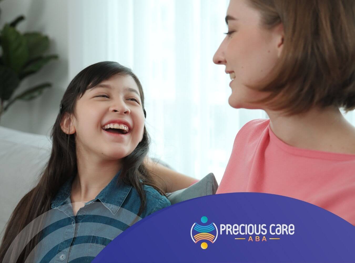 Autistic girl talking to ABA therapist during ABA therapy.