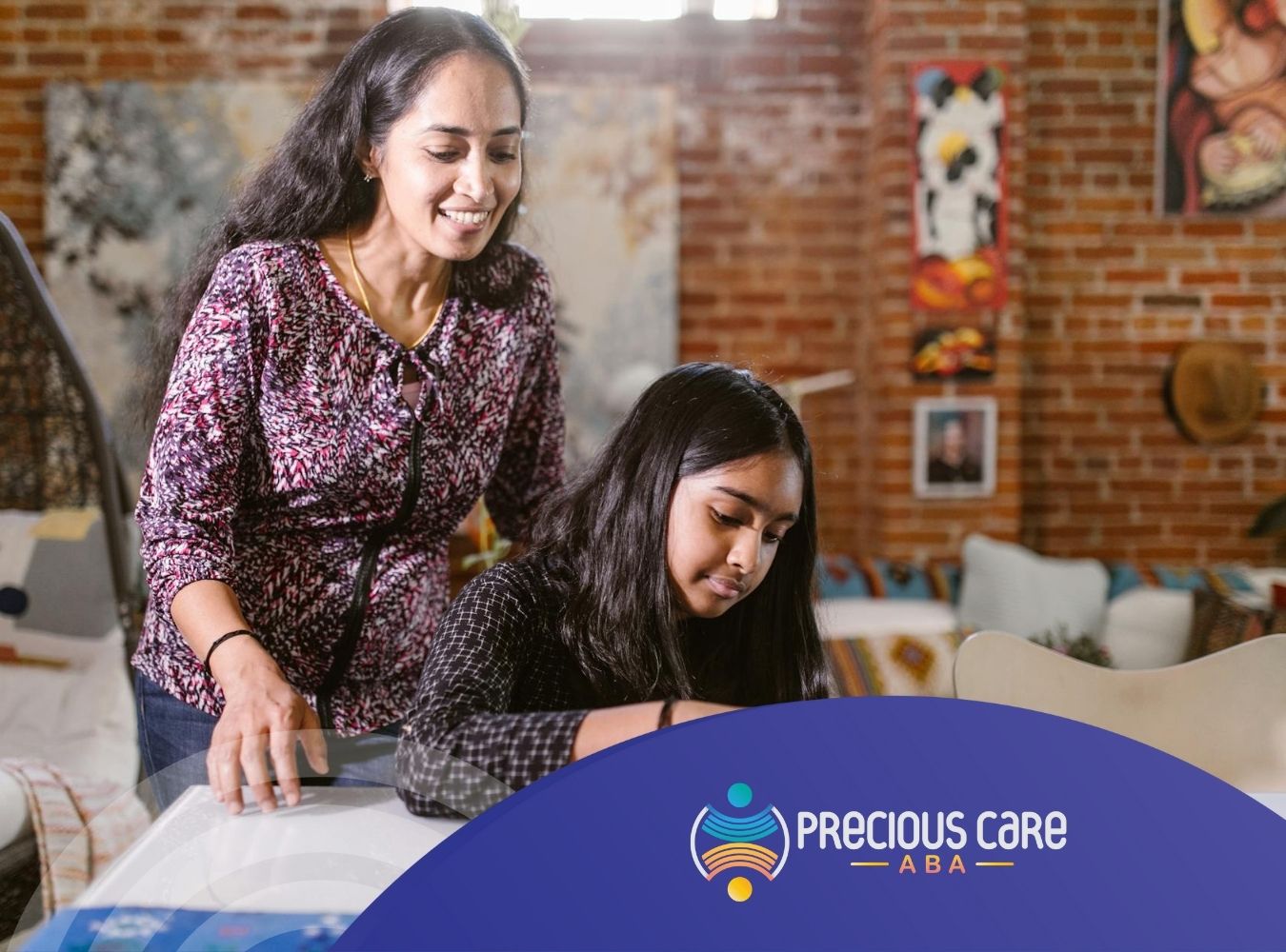 Smiling ABA therapist observing an autistic girl playing with wooden shapes at a table indoors in MD.