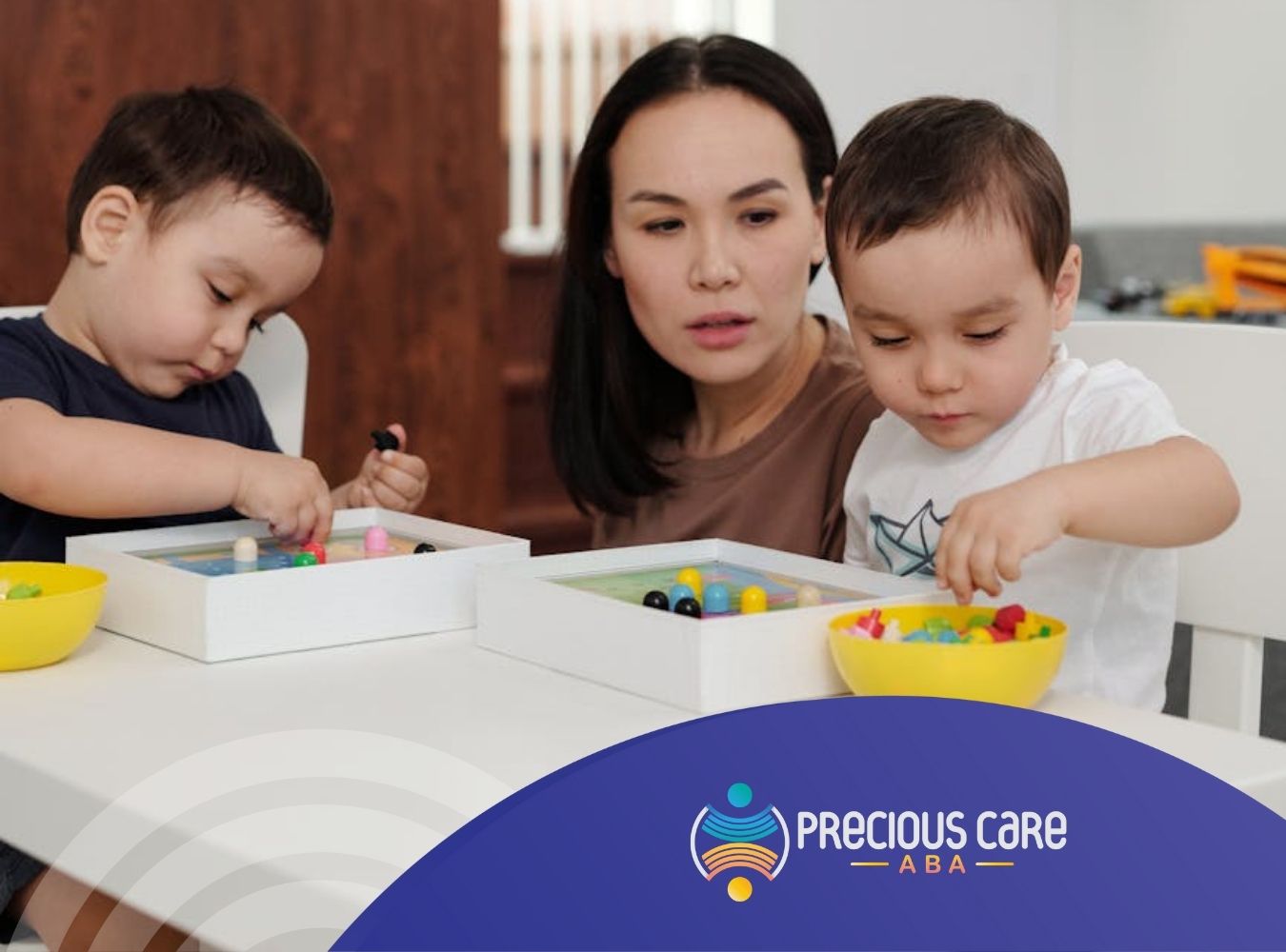 An ABA therapist and autistic children playing with colorful beads during ABA therapy in Colorado.